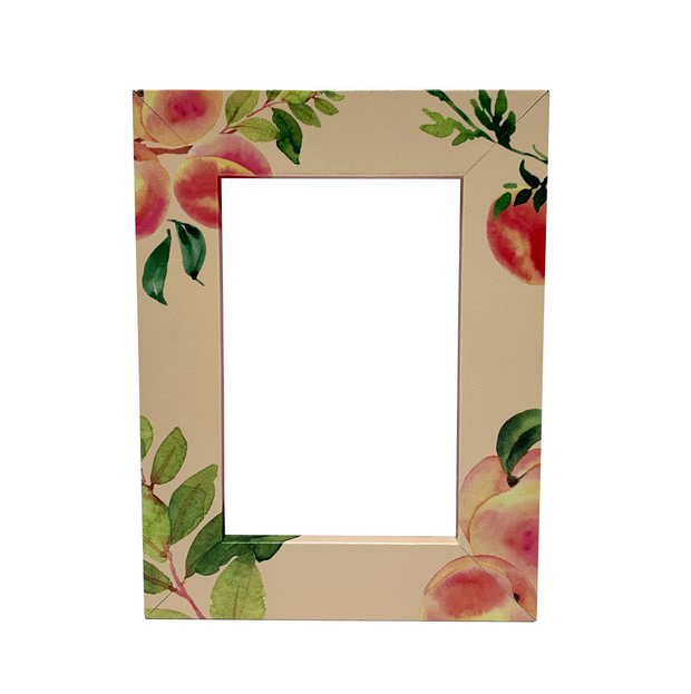 a picture frame with a picture of apples on it
