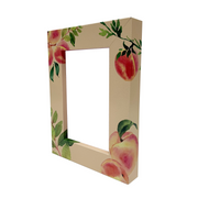 a picture frame with apples painted on it